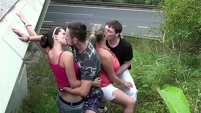 Cum on a chubby girl with big tits in extreme public foursome sex by a highway